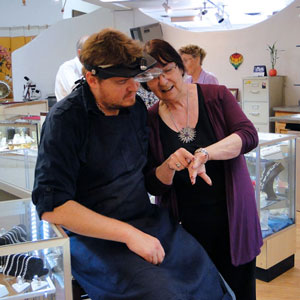 Paula consulting with jeweler on a ring repair